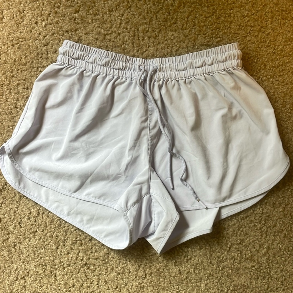 TNA lilac running shorts.